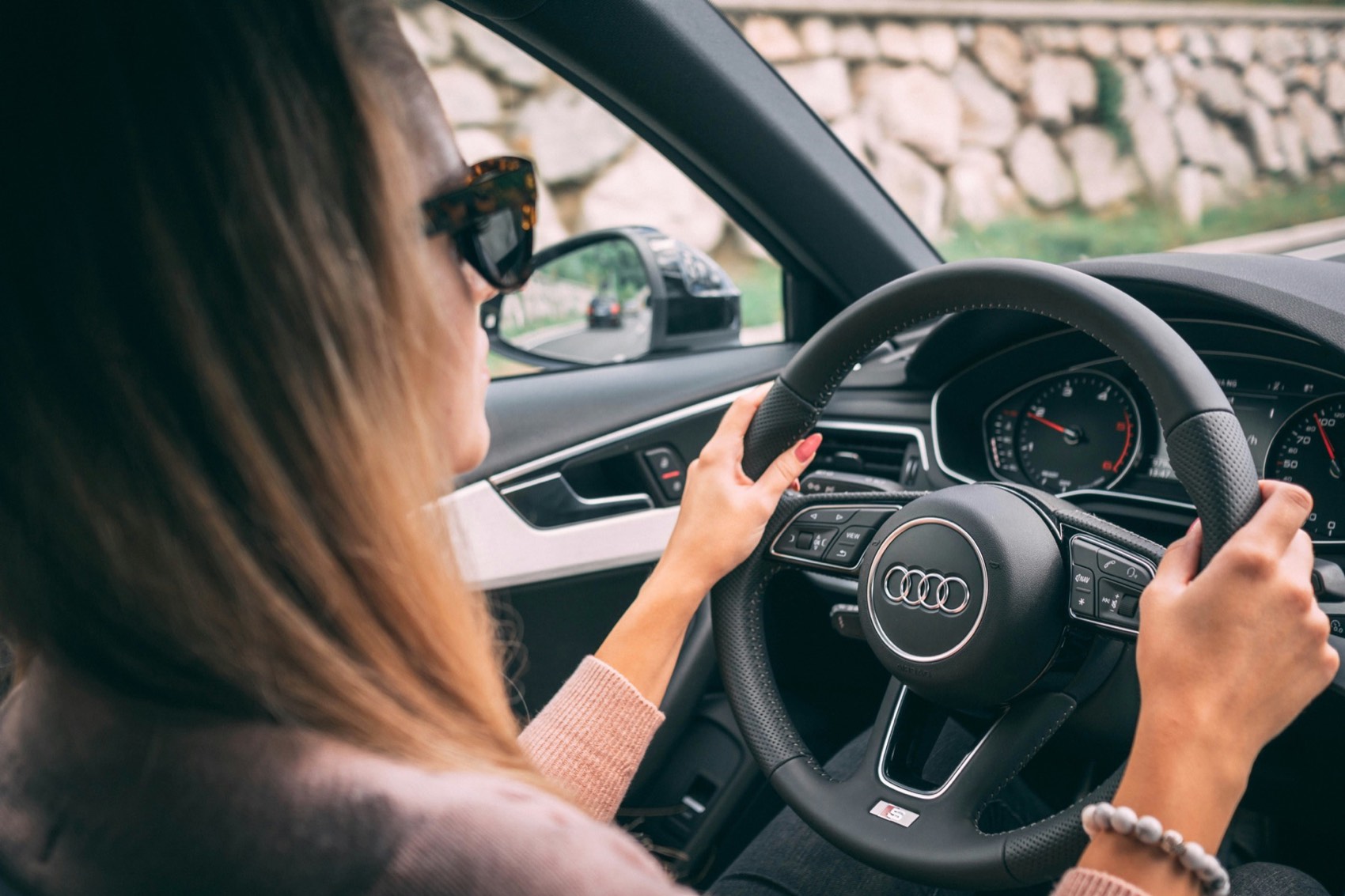 A confident learner driving with both hands on the wheel